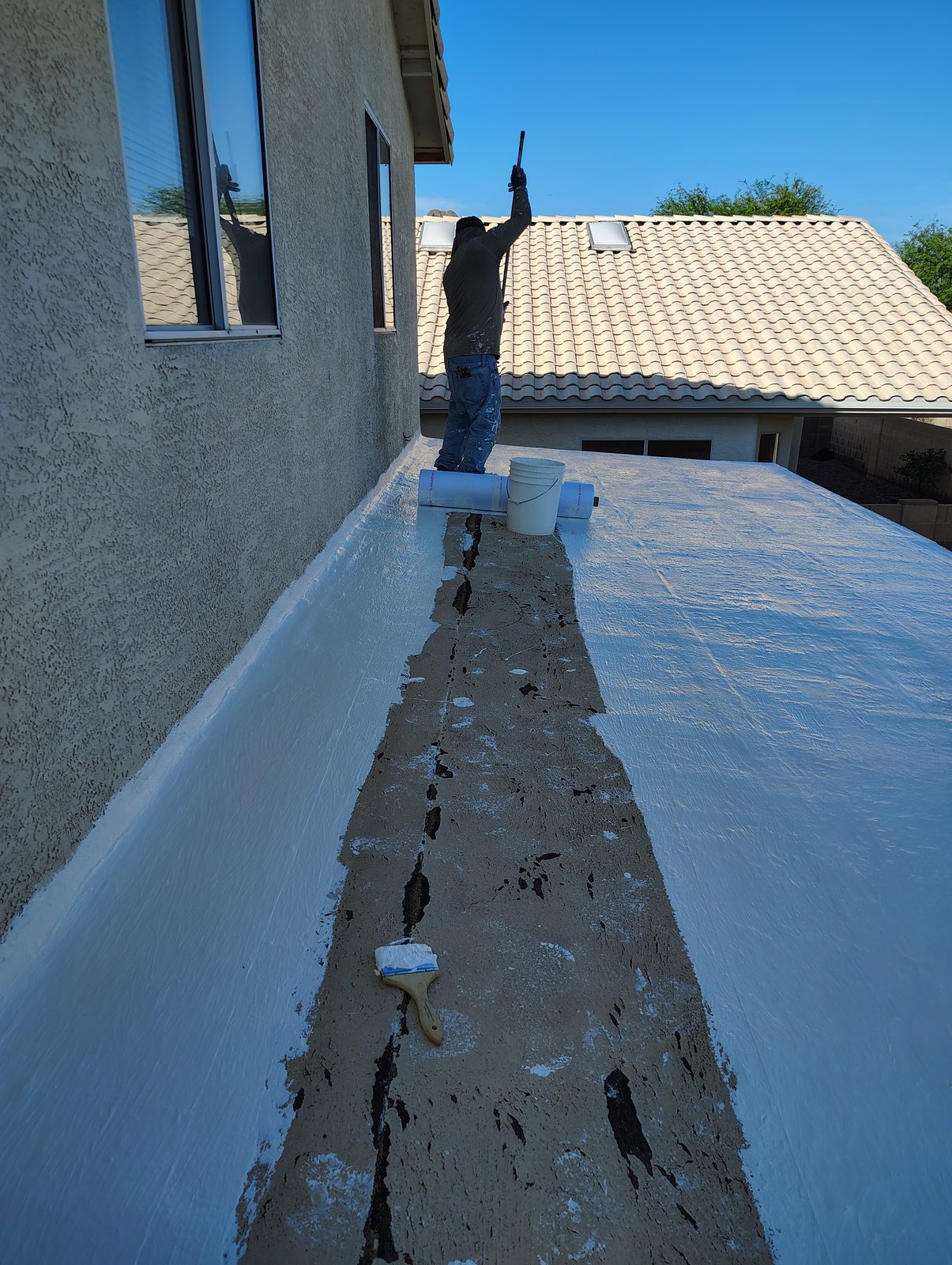 Roof restoration in progress on a Tucson low-sloped roof