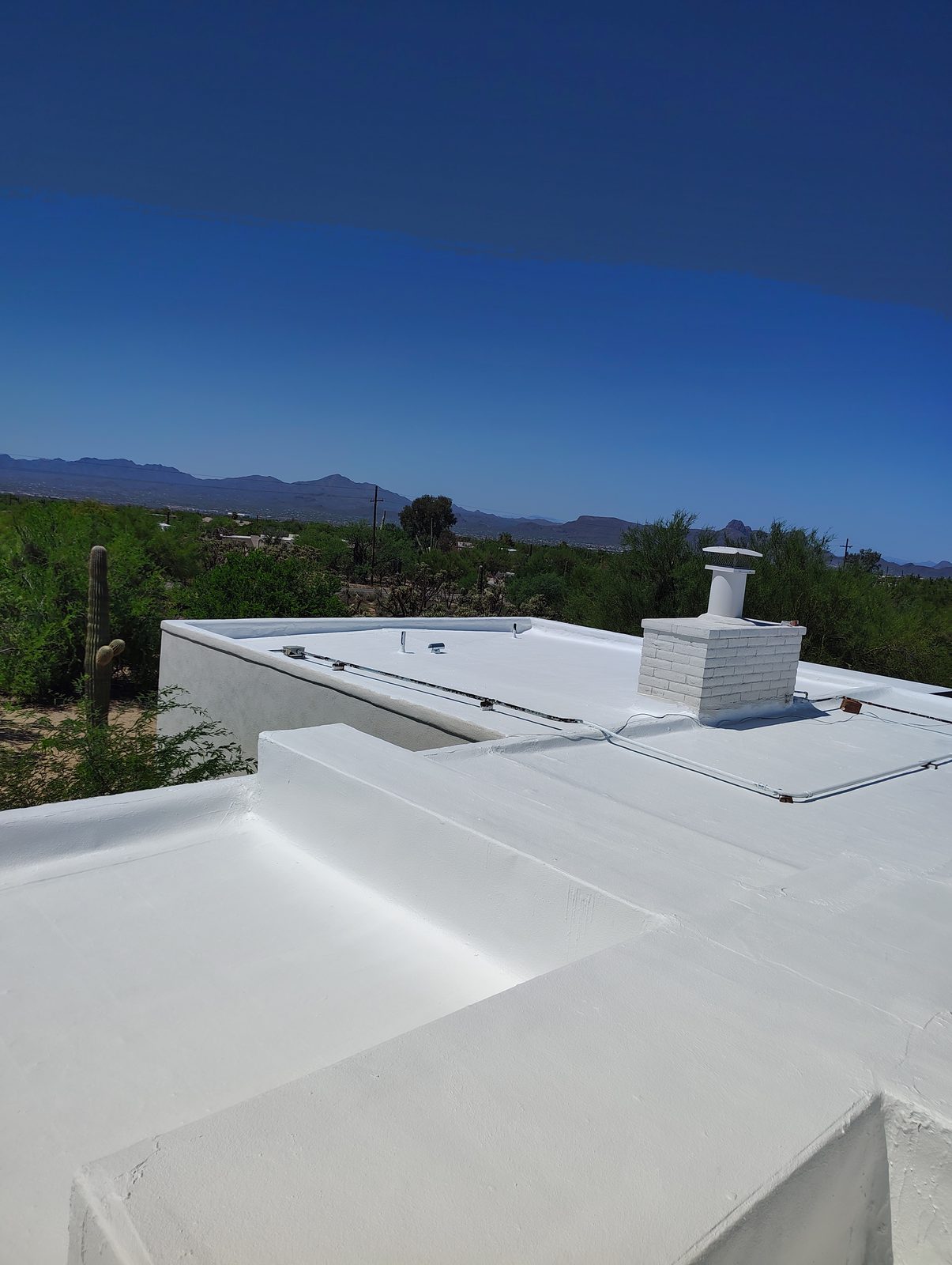 Bright white roof coating completed on a low slope home on Tucson's northwest side